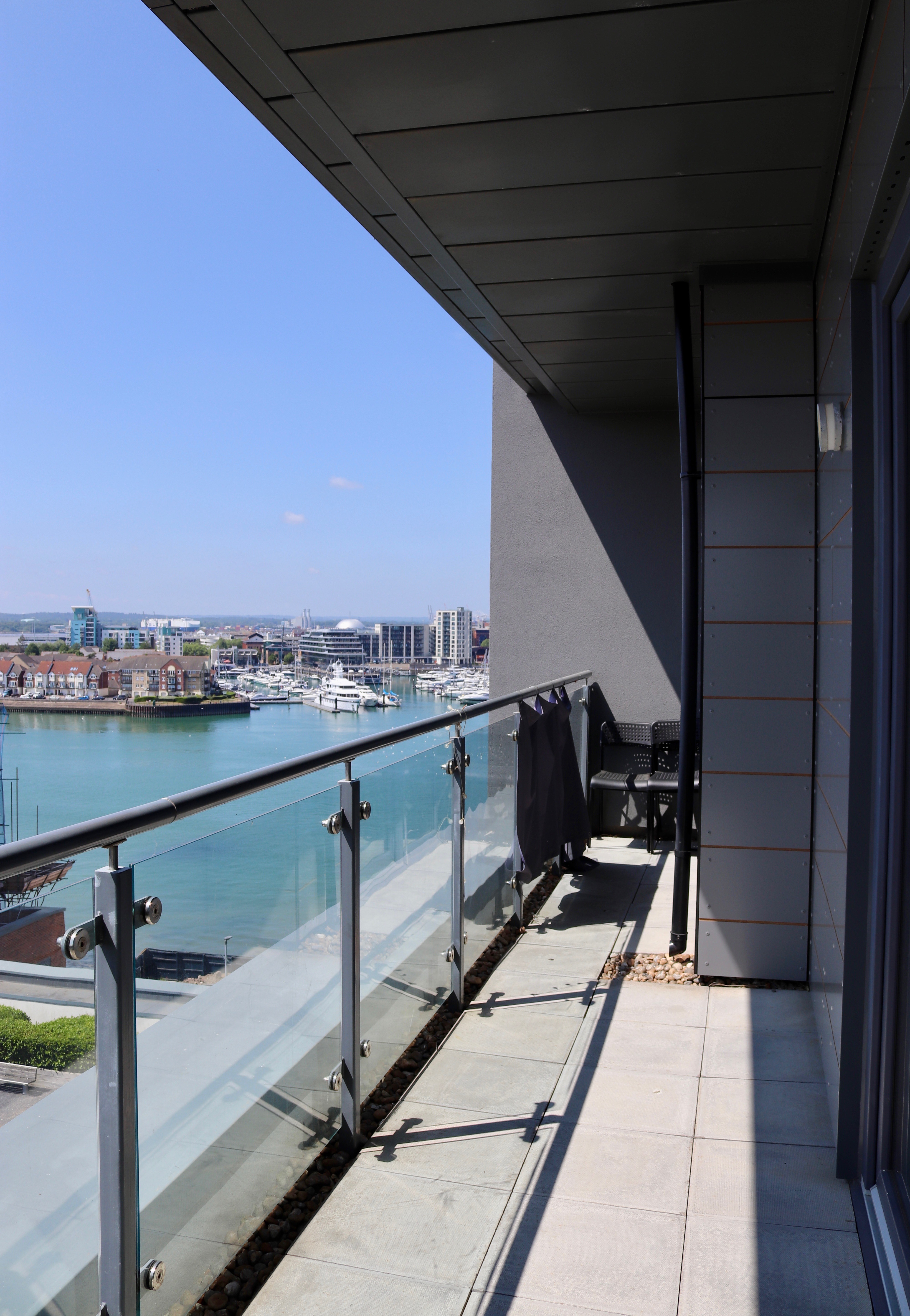 A genuine Cozy Breaks apartment balcony overlooking the marina